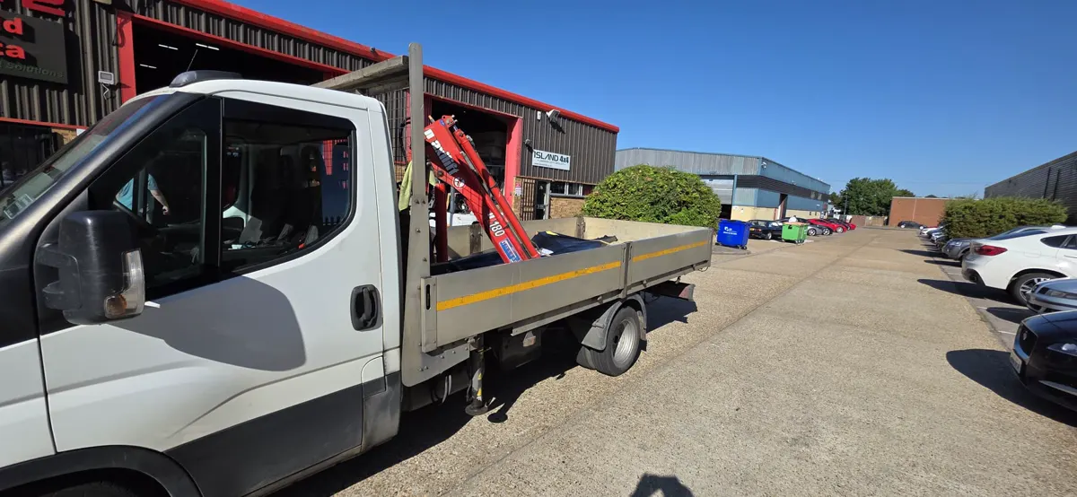 Dropside bed and crane of the 3.5 tonne HIAB van seen from the cab side